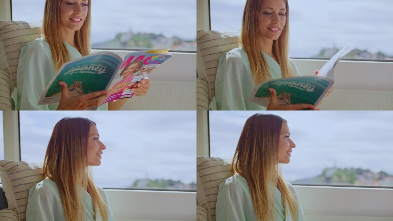 女人在游艇上阅读杂志并透过窗户看
