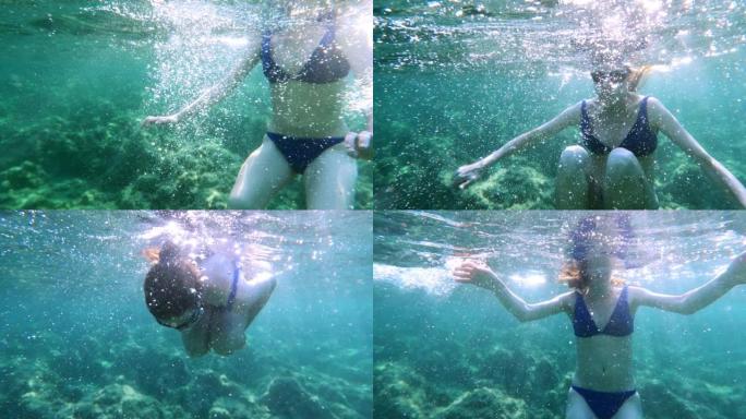 女人在海里浮潜。可穿戴相机视点