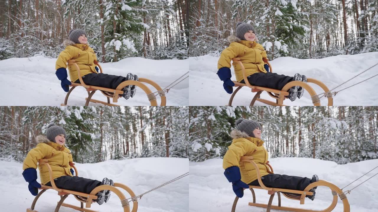 可爱的蹒跚学步的孩子在冬季森林里骑着雪橇，在大自然中的家庭散步中享受快乐和快乐