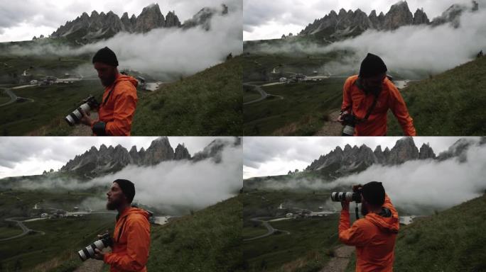男子摄影师在多洛米蒂山脉的高山徒步旅行: 恶劣的天气