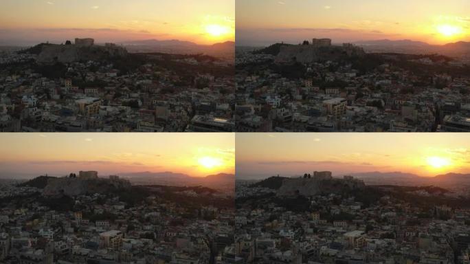 无人机鸟瞰图在日落时飞越雅典的城市场景