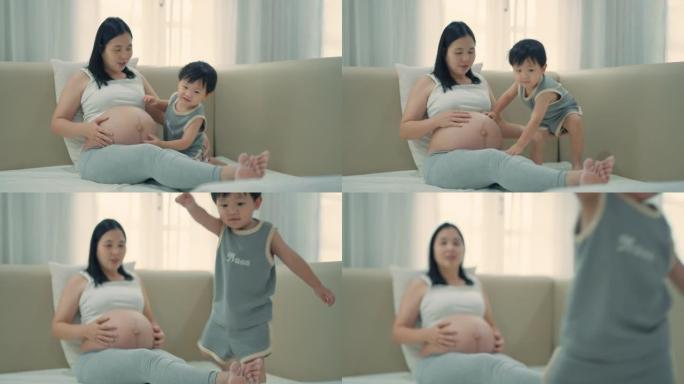 亚洲孕妇和儿子在家放松