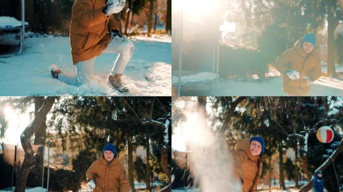 男孩向相机扔雪球打雪仗开心冬天