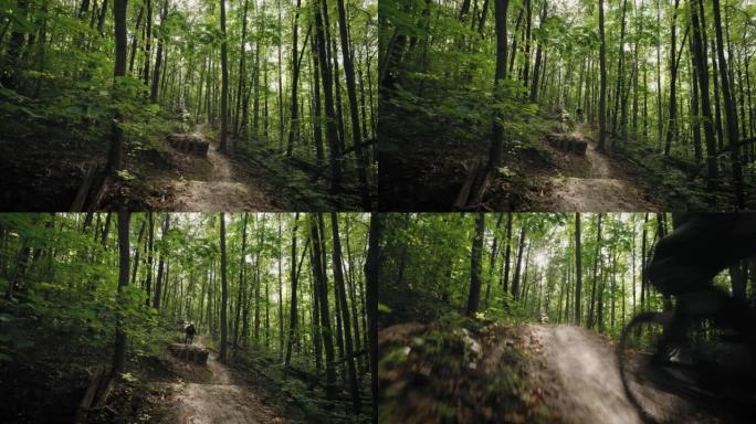 一名专业自行车手骑着山地自行车的电影镜头，在摄像机前高速骑行，跳过森林障碍物和蹦床。穿越森林的大气镜