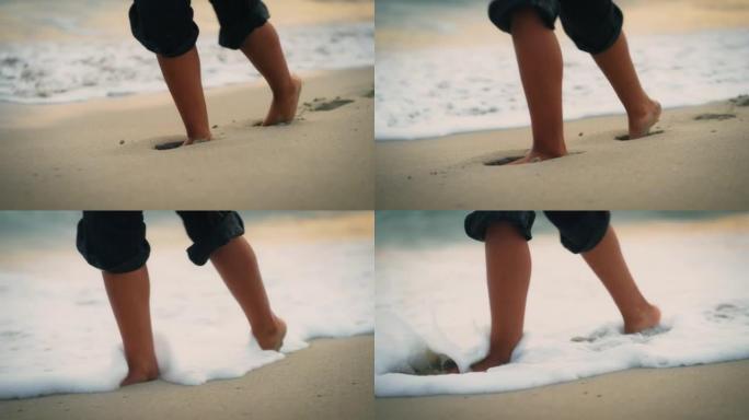 人的脚走出大海，在沙滩上行走
