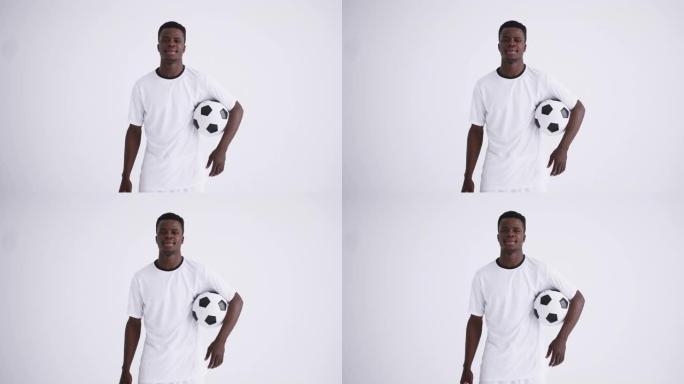 白色背景非裔足球运动员肖像，年轻运动员持球