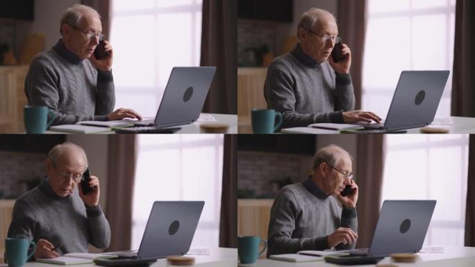 白发苍苍的老人在家庭办公室工作，会计正在用手机打电话，与同事或客户交谈