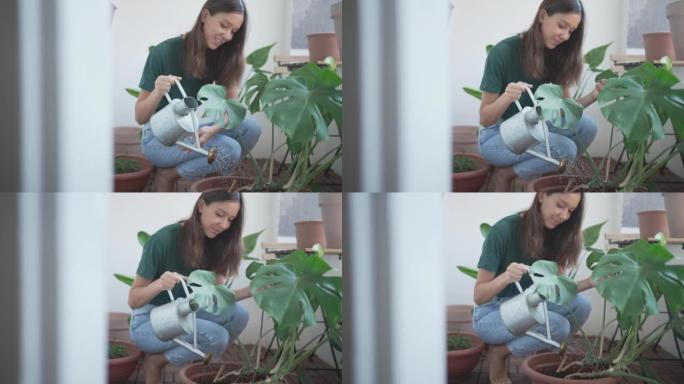 年轻女子倾向于在公寓外种植植物