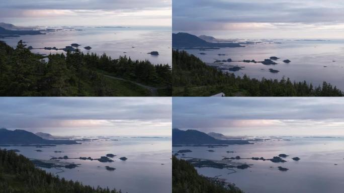 空中无人机拍摄日落时带有岛屿的海湾