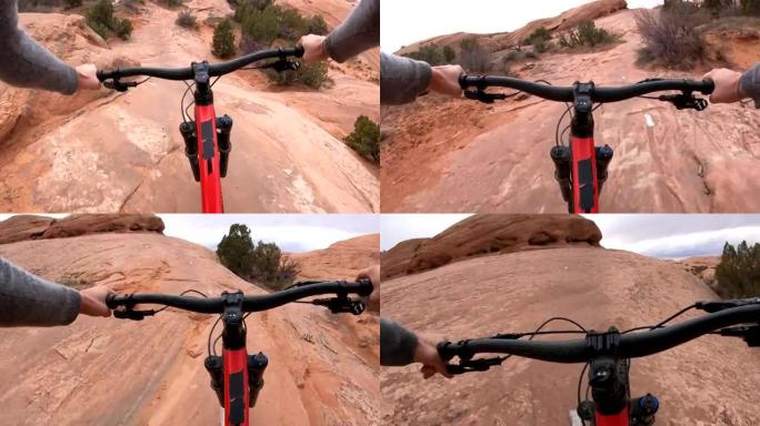 岩石上的山地自行车沙漠路径的第一人称视角