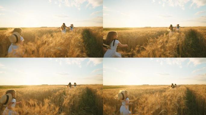 快乐的小女孩在夏日的金色麦田里奔跑，后视，快乐的孩子们玩耍