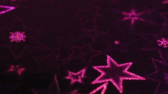 宏观幻灯片拍摄，粉红色的星星和雪花闪烁