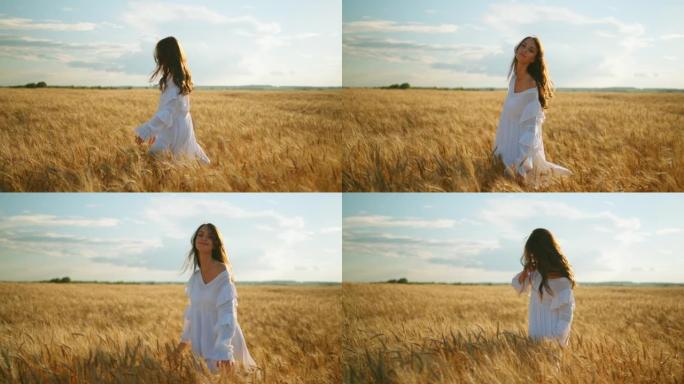 美丽的年轻女子，深色松散的头发，夏天在成熟的麦田上独自行走，慢动作