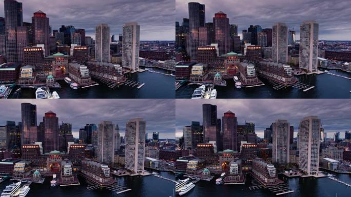 无人机飞越波士顿港口，朝海滨和市中心的摩天大楼