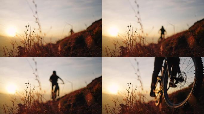 日落时，山地自行车手沿着山边骑行，下面的城市景观