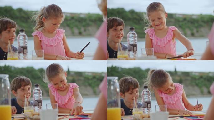 SLO MO小女孩和她的哥哥在游艇上画画