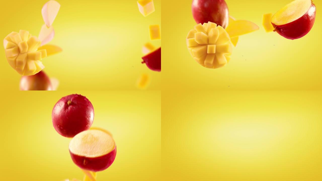 黄色背景下的芒果和切片的飞行