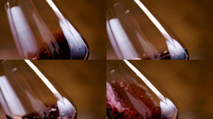 在玻璃杯中挥动的红酒的特写镜头