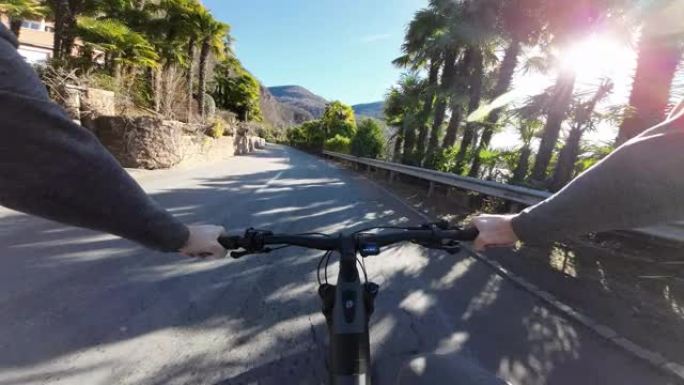 第一人称视角在路上骑电动山地车，天气晴朗