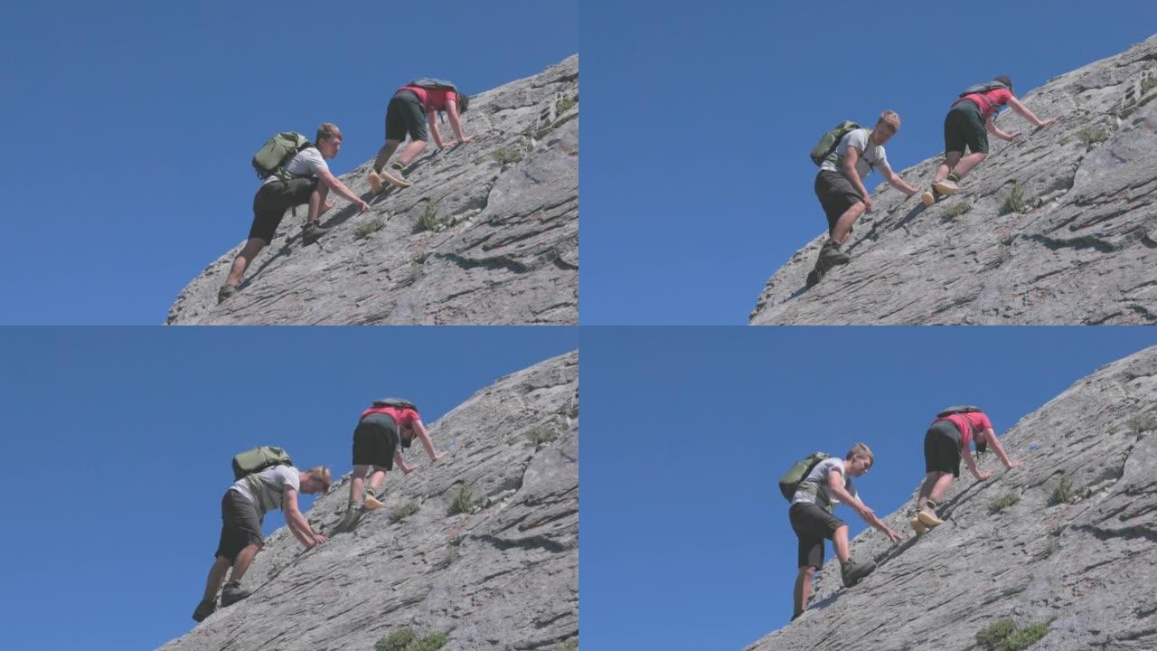 年轻人帮助小男孩攀岩