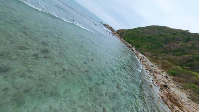 海南三亚鹿回头东海角山体海浪穿越机航拍