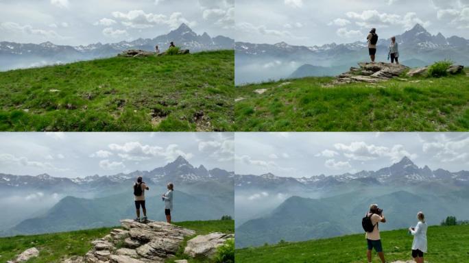 徒步旅行夫妇到达山顶并欣赏山景的鸟瞰图