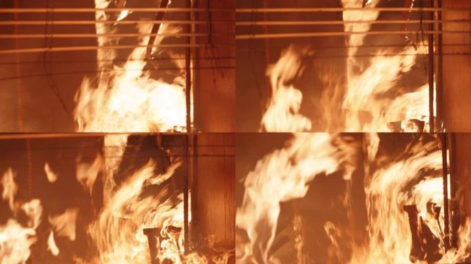 着火的家庭内部。窗户边燃烧的火，融化的百叶窗