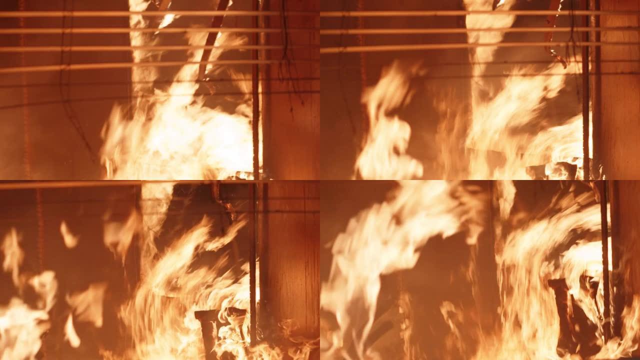 着火的家庭内部。窗户边燃烧的火，融化的百叶窗