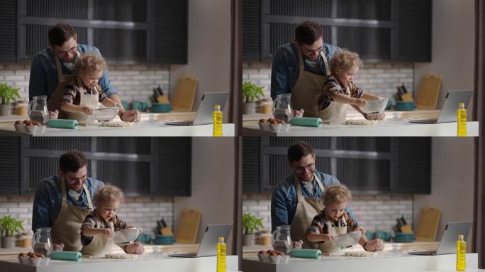 当他的小儿子在家里一起做饭时，慈爱的父亲在笑。