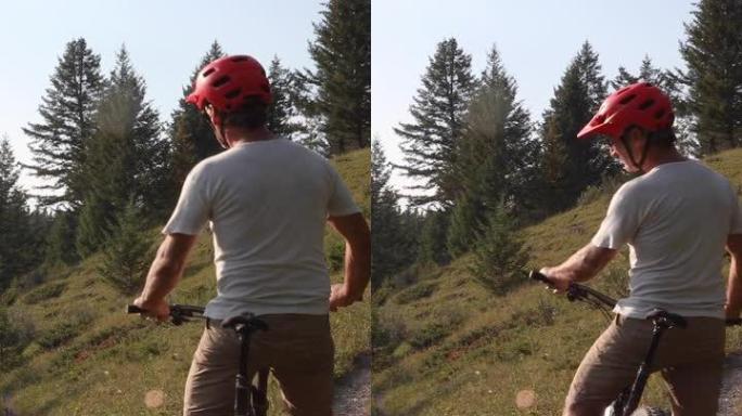 Man mountain biker通过trail fork，选择方向