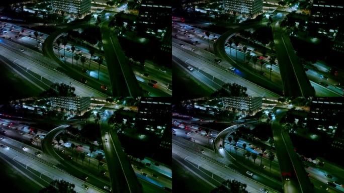 静态无人机在晚上在洛杉矶的第五街立交桥和110高速公路上低头