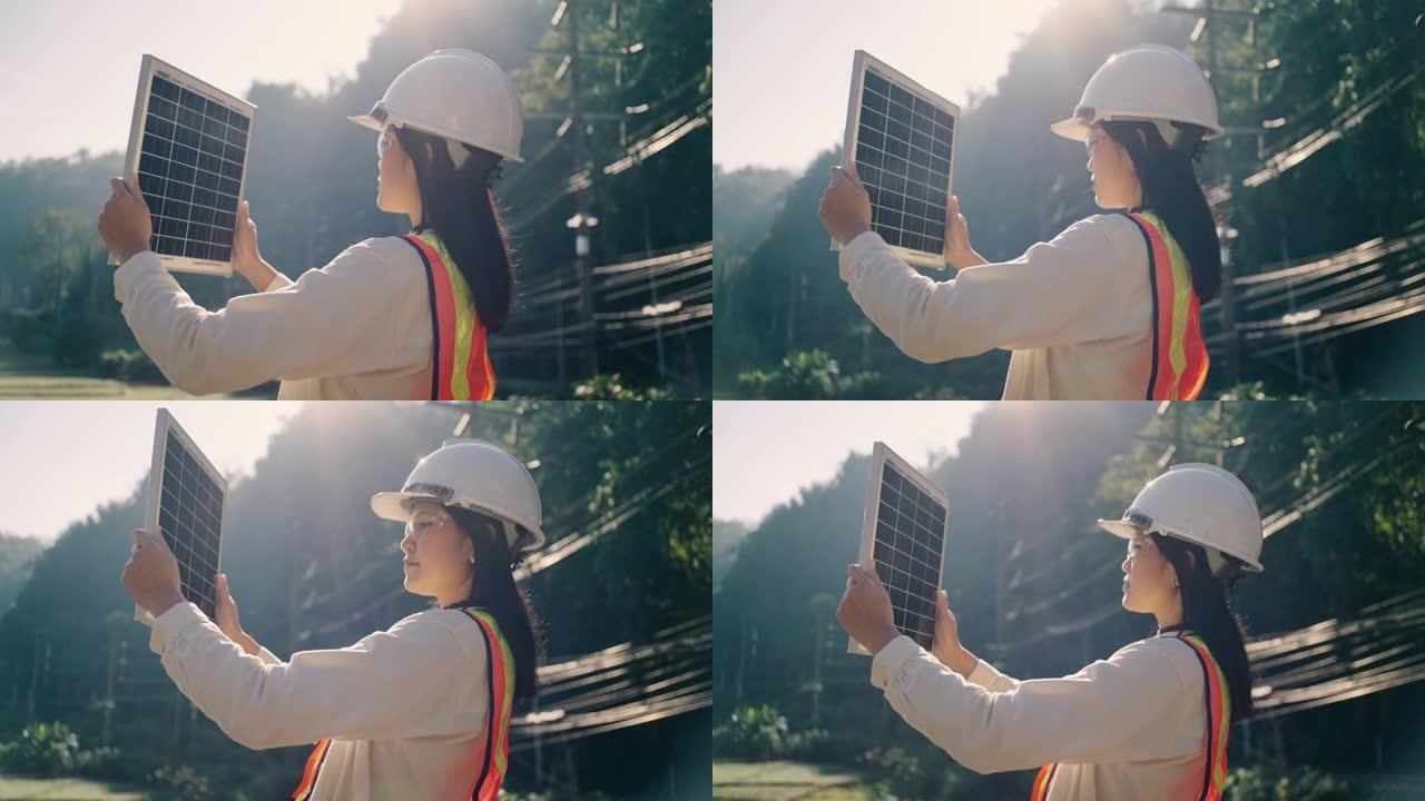 在现场广播中交谈的女工程师在电力无法到达的农村地区安装太阳能电池板