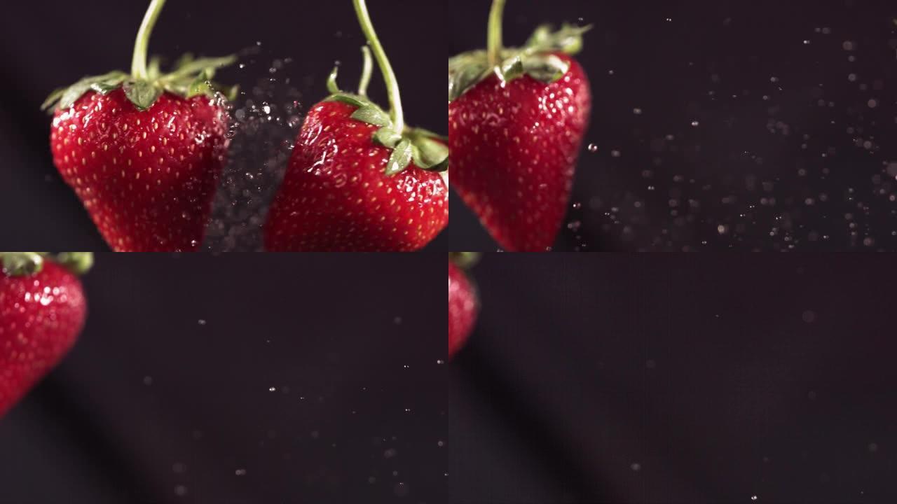 两个大草莓在黑色背景上飞来飞去碰撞