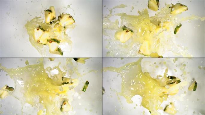爆炸菠萝和爆裂果汁和切片的超慢动作