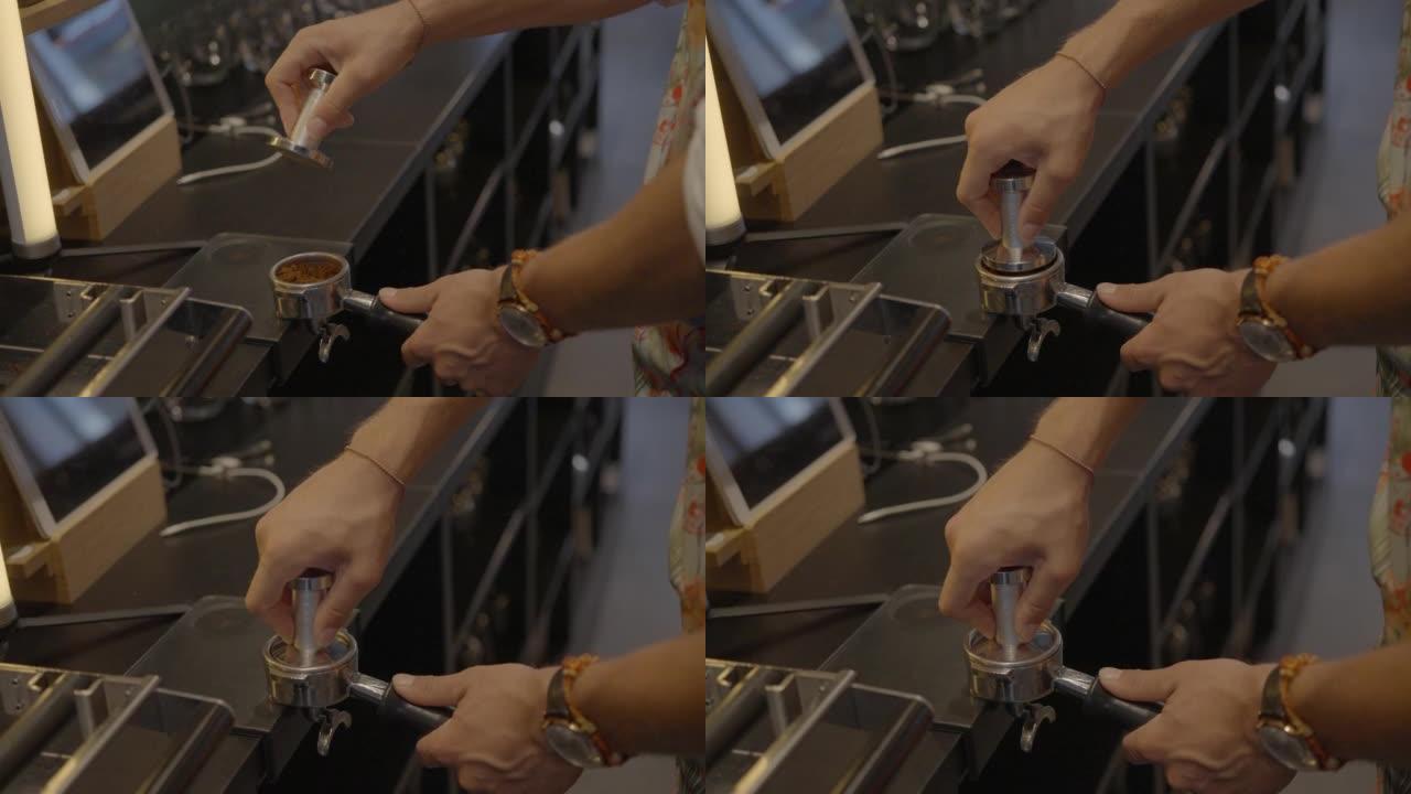 一个男人在咖啡馆里做浓缩咖啡的特写镜头