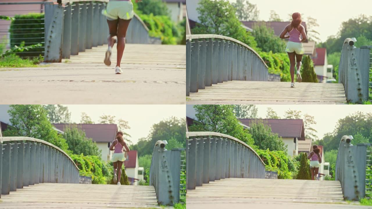 女跑步者在桥上奔跑