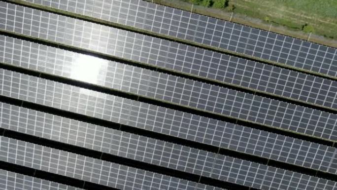 在野外拍摄太阳能电池板的空中无人机