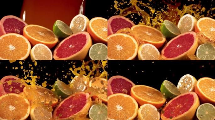 慢动作拍摄柑橘类水果和果汁通过柠檬，酸橙，葡萄柚片飞溅