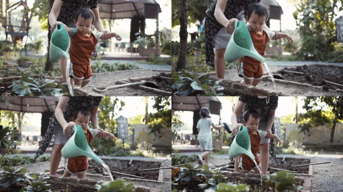 男孩给花园浇水