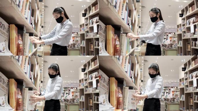 亚洲女人戴防护面膜布看书。