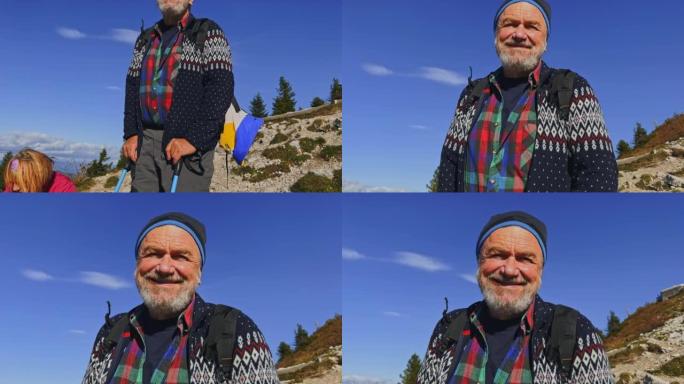 阳光山顶上微笑的高级男徒步旅行者的SLO MO肖像
