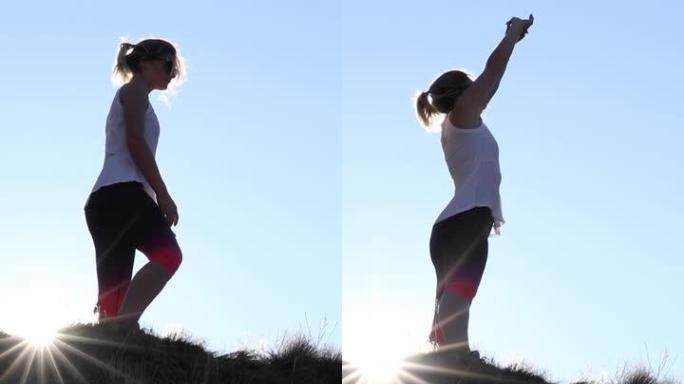女越野跑运动员登上陡峭的山坡
