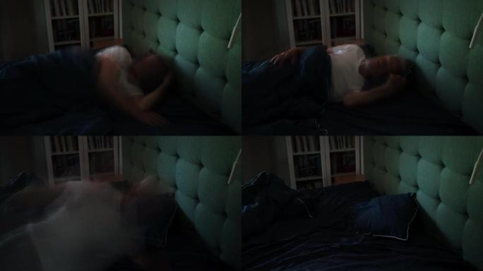 男人把凌乱的床单留在空卧室里。失眠症。时间流逝