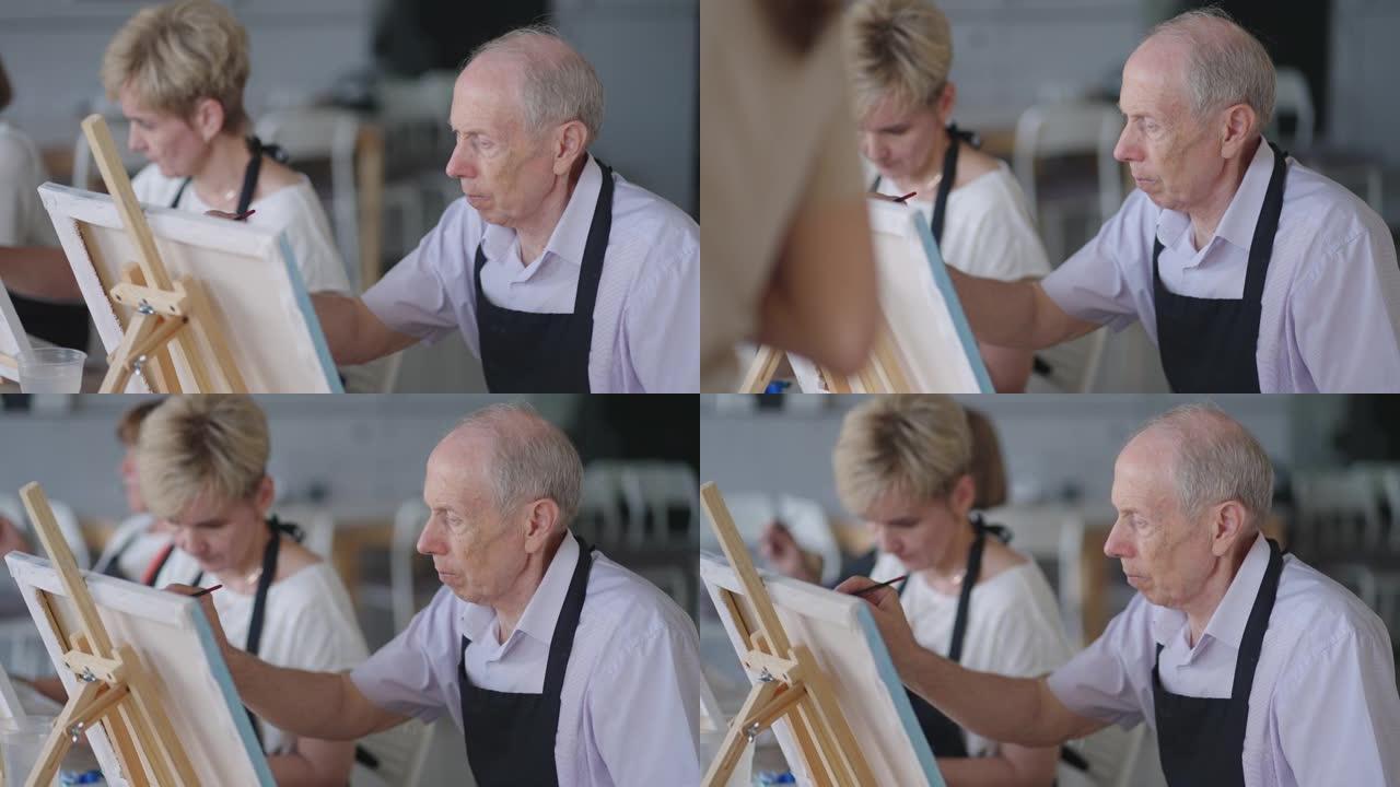 一对老年夫妇退休后聚在一起参加绘画课程。家庭老年恋人