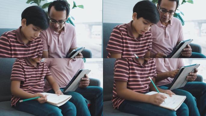 十几岁的男孩在家里和父亲一起学习