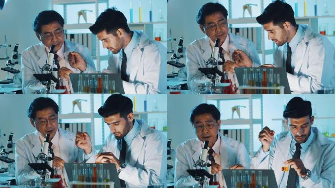 两位教授在实验室测试液体溶液。