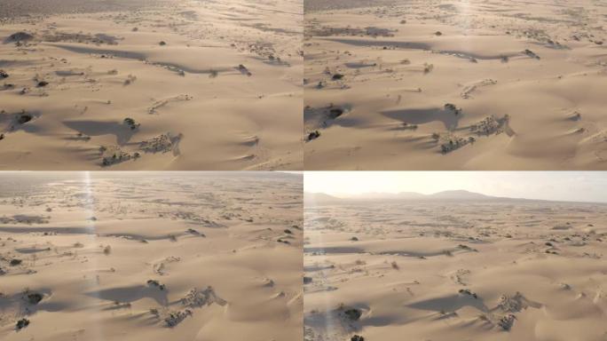 空中无人机在岛上的沙丘上射击