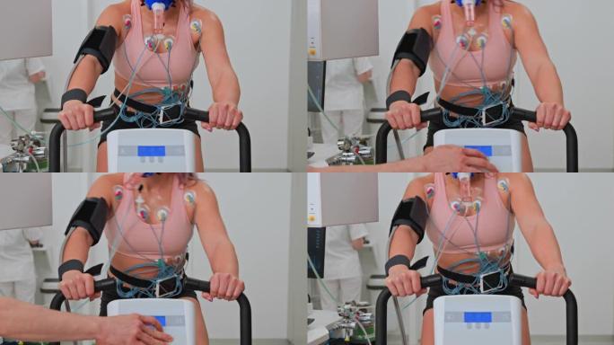 LD女运动员在诊所的自行车测力计上进行心肺压力测试