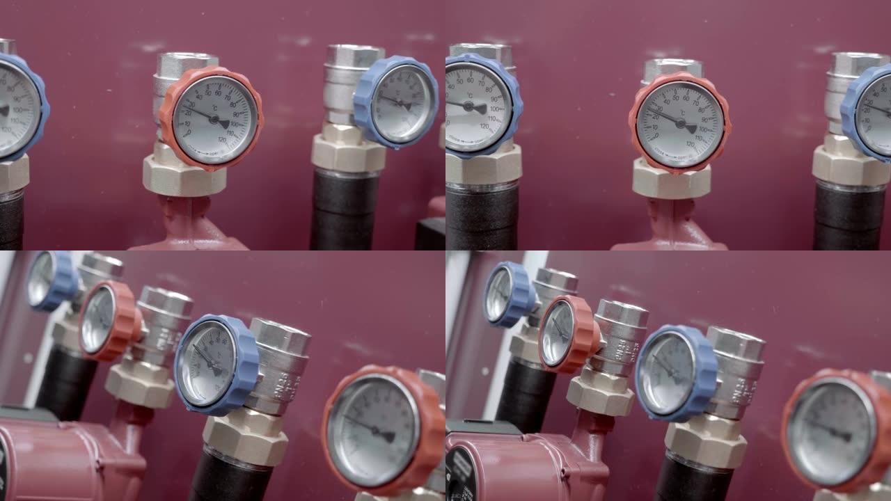 带有温度计的管道，用于控制家庭供暖系统中的水预热