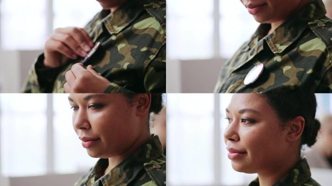 特写的非裔美国女士兵佩戴投票别针，选举在美国
